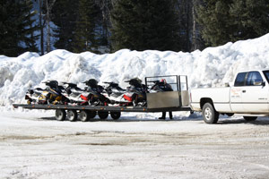 Transporting your snowmobile using a flat bed trailer