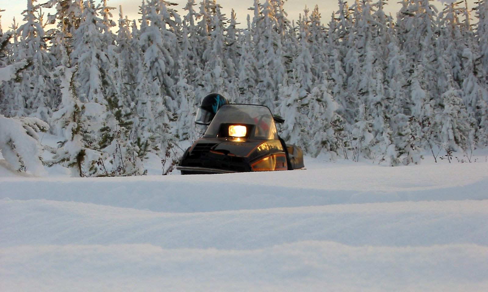 Snowmobile with light on