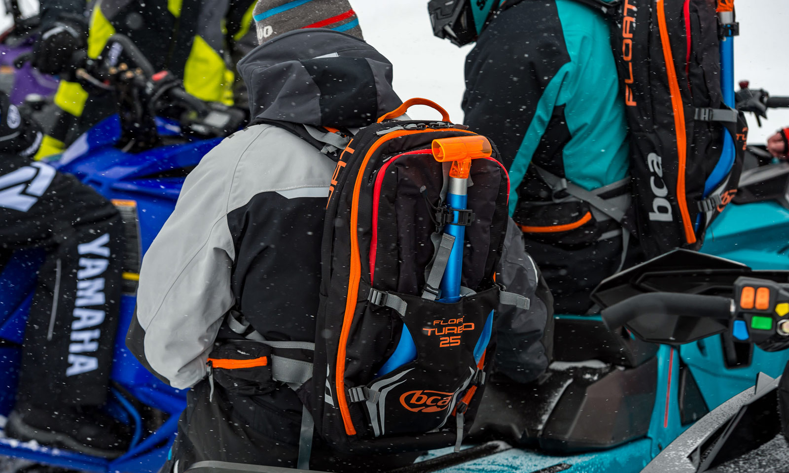 Snowmobile with backpack of gear