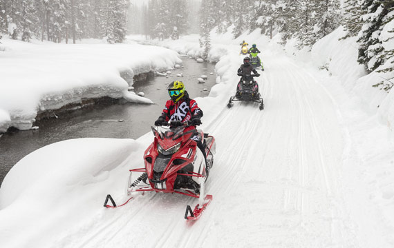 Snowmobiling on trail