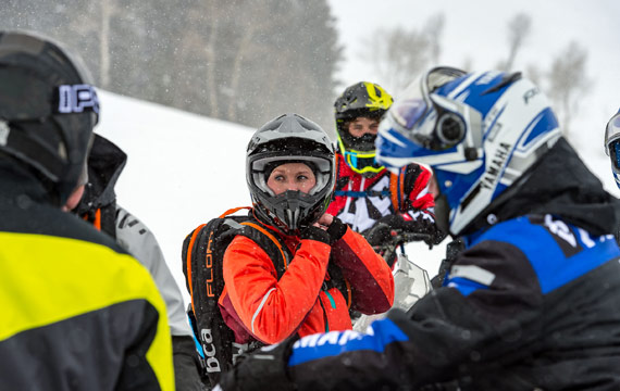 Warmly dressed snowmobilers